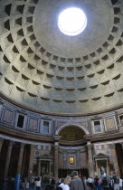 The interior with tourists and dome of the Pantheon the Roman temple of all the gods designed and built by Emperor Hadrian converted into a Christian church in the Middle AgesEuropean Italia Italian...