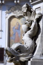 Detail of a dolphin on the Fountain of Piazza Della Rotonda by Giacomo Della Porta in 1575 with a religious fresco on the wall of a building beyondEuropean Italia Italian Roma Southern Europe History...