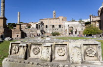 The Forum with tourists. Details of ruin fragments with the Arch of Septimius Severus in the centreEuropean Italia Italian Roma Southern Europe Center History Holidaymakers Tourism