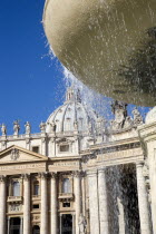 Vatican City The Basilica of St Peter and the square or Piazza San Pietro with tourists and a water fountain in the foregroundEuropean Italia Italian Roma Southern Europe Catholic Principality Citta...