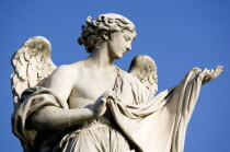 Statue of a winged female angel on the Ponte Sant Angelo bridge over the River TiberEuropean Italia Italian Roma Southern Europe Gray History Religion Religious