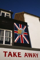 Neptune Fish and Chip Shop Take Away sign with Union Jack flag.Seaside townEuropean Great Britain UK United Kingdom British Isles Northern Europe Store