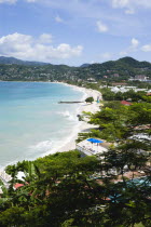 Waves of the aquamarine sea breaking on the two mile stretch of the white sand Grand Anse BeachCaribbean Grenadian Greneda West Indies Grenada 2 Beaches Holidaymakers Resort Sandy Scenic Seaside Shor...