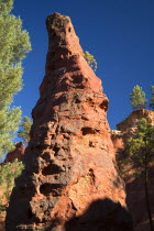 A tall thin  eroded pinnacle of rock in the area known as the Needle CirqueOchre Trail European French Western Europe