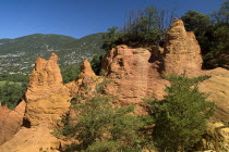 Colorado Provencal.  Cheminee de Fee or Fairy Chimneys.  Eroded ochre rock forms and surrounding landscape from viewpoint.Ochre Trail European French Western Europe