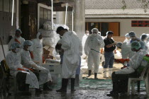 Tsunmai. Volunteers being hosed down after retrieving dead bodies.Asian Ecology Entorno Environmental Environnement Green Issues Southern Prathet Thai Raja Anachakra Thai Siam Southeast Asia