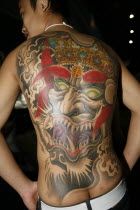 Tattoo on mans back.Asian Southern Prathet Thai Raja Anachakra Thai Siam Southeast Asia