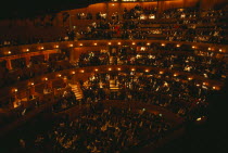 Interior of auditorium with audience members taking their seats before Opera performance.European Great Britain Northern Europe Public Presentation UK United Kingdom British Isles