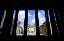 The Piazza della Rotunda busy with tourists seen through granite columns of the PantheonEuropean Italia Italian Roma Southern Europe History Holidaymakers Religious Tourism Religion