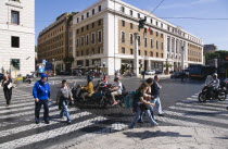 Pedestrian crossing with people and traffic on the Via della ConciliazioneEuropean Italia Italian Roma Southern Europe Gray Holidaymakers Tourism Tourist Grey Sightseeing Tourists