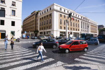 Pedestrian crossing with people and traffic on the Via della ConciliazioneEuropean Italia Italian Roma Southern Europe Gray Holidaymakers Tourism Tourist Grey Sightseeing Tourists