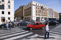 Pedestrian crossing with people and traffic on the Via della ConciliazioneEuropean Italia Italian Roma Southern Europe Gray Holidaymakers Tourism Tourist Grey Sightseeing Tourists