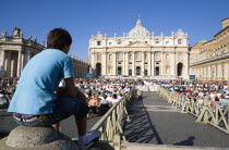 Vatican City Pilgrims seated in St Peters Square for the wednesday Papal Audience in front of the BasilicaEuropean Italia Italian Roma Southern Europe Catholic Principality Citta del Vaticano Holiday...