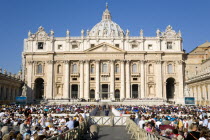 Vatican City Pilgrims seated in St Peters Square for the wednesday Papal Audience in front of the BasilicaEuropean Italia Italian Roma Southern Europe Catholic Principality Citta del Vaticano Holiday...