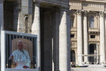 Vatican City Pope Benedict XVI Joseph Alois Radzinger seen on a large video TV monitor display and seated under a canopy in St Peters Square for the wednesday Papal Audience in front of the BasilicaE...