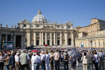 Vatican City Pilgrims in St Peters Square for the wednesday Papal Audience in front of the BasilicaEuropean Italia Italian Roma Southern Europe Catholic Principality Citta del Vaticano Holidaymakers...