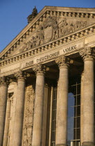 The Reichstag  seat of German Parliament.  Part view of colonnaded exterior designed by Paul Wallot 1884-1894.  To The German People inscribed above entrance .neo-renaissanceBundestagDem Deutschen...