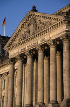 The Reichstag  seat of German Parliament.  Part view of colonnaded exterior designed by Paul Wallot 1884-1894.  To The German People inscribed above entrance .neo-renaissanceBundestagDem Deutschen...