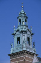 Detail of church clock tower of Wawel Cathedral with statues positioned at four corners of base.4 Eastern Europe European Polish Polska Cracow Krakov Religion Religious History