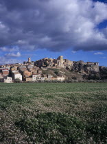 El Pinell de Brai. Hilltop village seen from field of flowers below European Scenic Southern Europe  Espainia Espana Espanha Espanya Hispanic Spanish Catalunya Catalonia