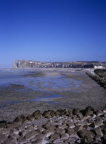 View north east along shoreline by town Mers les Bains. Chalk cliffs beyond and tide out.On the border between Picardie and NormandyPicardyEuropean Scenic French Western Europe Northern