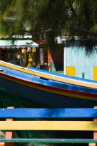 Colourful bench boat and food stalls in Mulzac Square in CliftonBeaches Resort Sand Sandy Scenic Seaside Shore Tourism West Indies Caribbean Colorful Windward Islands Beaches Resort Sand Sandy Sceni...