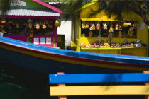 Colourful bench boat and food stalls in Mulzac Square in CliftonBeaches Resort Sand Sandy Scenic Seaside Shore Tourism West Indies Caribbean Colorful Windward Islands Beaches Resort Sand Sandy Sceni...