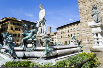 The 1575 Mannerist Neptune fountain  with the Roman sea God surrounded by water nymphs commemorating Tuscan naval victories  by Ammannatti in the Piazza della Signoria beside the Palazzo VecchioEurop...