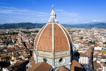 The Dome of the Cathedral of Santa Maria del Fiore the Duomo by Brunelleschi with tourists on the viewing platform looking over the city towards the surrounding hillsEuropean Italia Italian Southern...