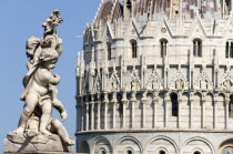 A statue of three Cherubs in front of the Baptistry in The Campo dei Miracoli or Field of Miracles.European Italia Italian Southern Europe Toscana Tuscan 3 Religion Religious