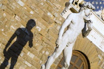 The copy of the statue of David by Michelangelo casting its shadow on the Palazzo Vecchio in the Piazza della SignoriaEuropean Italia Italian Southern Europe Toscana Tuscan Firenze History Religion