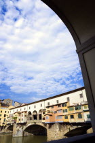 The 14th Century Ponte Vecchio or Old Bridge across the River Arno showing the backs of the goldsmiths workshops that hang over the waterEuropean Italia Italian Southern Europe Toscana Tuscan Firenze...