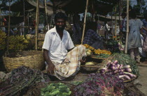 Vegetable vendor in marketplace.Asia Asian Bangladeshi One individual Solo Lone Solitary Asia Asian Bangladeshi One individual Solo Lone Solitary