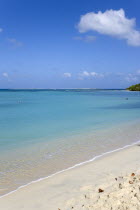 Waves breaking on Paradise Beach at LEsterre Bay with the turqoise sea and Sandy Island sand bar beyond.Beaches Caribbean Destination Destinations Grenadian Greneda Resort Sand Sandy Scenic Seaside S...