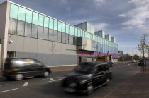 Falls Road  Exterior of the refurbished Falls Swimming Baths with black taxi cabs passing by.Northern Beal Feirste Eire ArchitectureUrbanBeal FeirsteNorthernTransportBusTaxibusPoolLeisure Cen...