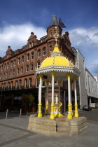 Victoria Square  Yellow coloured Victorian Jaffe drinking fountain outside the entrance to the shopping centre.Stephen RaffertyUrbanBeal FeirsteArchitectureNorthernCenterMallNorthern Beal Feirs...