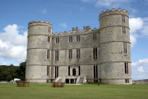 Lulworth Castle with tables and chairs on lawns outside.Lulworth Castle  UK  England  Dorset  estate  English  heritage  history  picturesque  17th century  historic  United Kingdom  Great Britain  B...