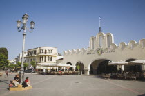 Plateia Eleftherias Kos Town Square with market entrance in backgroundGreek IslandsResort Summer Clear Blue Sky early season Aegean DodecaneseDestination Destinations Ellada European Greek Southern...