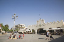 Plateia Eleftherias Kos Town Square with market entrance in background.Greek IslandsResort Summer Clear Blue Sky early season Aegean DodecaneseDestination Destinations Ellada European Greek Southern...