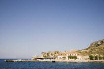 View across the harbour entrance.Greek IslandsResort Summer Clear Blue Sky early season Aegean DodecaneseDestination Destinations Ellada European Greek Southern Europe