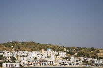 Town viewed from the the sea with the blue dome of the church visible.Greek IslandsResort Summer Clear Blue Sky early season Aegean DodecaneseDestination Destinations Ellada European Greek Southern...