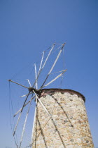 Traditional stone windmill against clear blue sky.Greek IslandsAegeanMediterraneanKossummerseasonholidayDestination Destinations Ellada European Greek Southern Europe Classic Classical Histori...