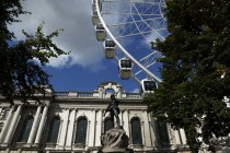 Ferris wheel next to City Hall and memorial statue for soldiers lost during the Boer War.ArchitectureIrishEuropeanIrelandEuropeUlsterBeal FeirsteNorthernMemorialStatueRiflemanFerrisWheel...