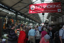 St Georges Market on a busy friday morning  busy with shoppers. Large No Smoking sign visible.Beal Feirste Eire European Irish Northern Northern Europe Republic Ireland Poblacht na hEireann Immature...