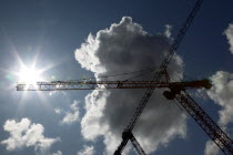 Lanyon Place  Cranes seen through sunlightBeal Feirste Eire European Irish ConstructionBuildingCraneCranesPatternNorthern Northern Europe Republic Ireland Poblacht na hEireann Blue Clouds Cloud S...