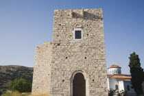 Pythagorio.  Logothetes Castle ruins beside white painted Metamorfosis Sotiros Greek orthodox church.Lykourgos of SpartaLycurgusNorth Eastern AegeanGreek IslandsPithagorion Pythagorioncoast coas...