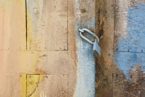 Detail of padlocked wooden doorway with patches of faded blue and yellow paint.AegeanGreek IslandsSimicoast coastalseaSummerpackageholidayresortvacationtripdestinationDestinations Ellada...