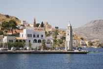 Yialos.  Waterside buildings and clock tower.AegeanGreek IslandsSimicoast coastalseaSummerpackageholidayresortvacationtripdestinationDestinations ElladaEuropeanSouthern EuropeDestinati...