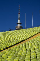 Olympic Stadium  The colourful green seats in the stadium with the Olympic Tower behind.Bayern Deutschland European Mnchen Western Europe Bavaria Blue Colorful History Historic Holidaymakers One ind...