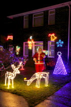 England, West Sussex, Southwick, Cul de Sac of house decorated with fairy lights for Christmas.